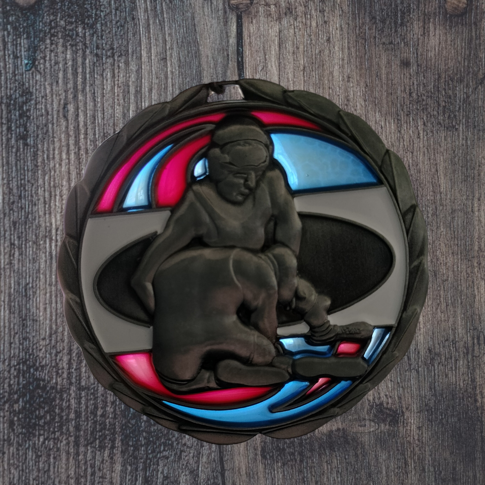 Wrestling medal with resin